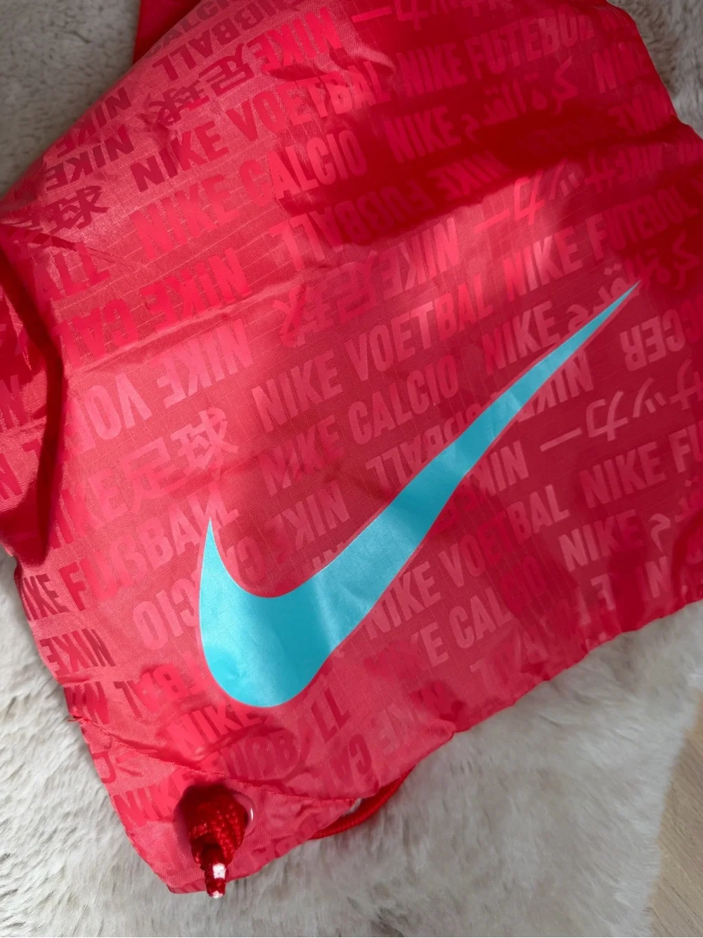 Nike Red Drawstring Backpack with Gray Swoosh